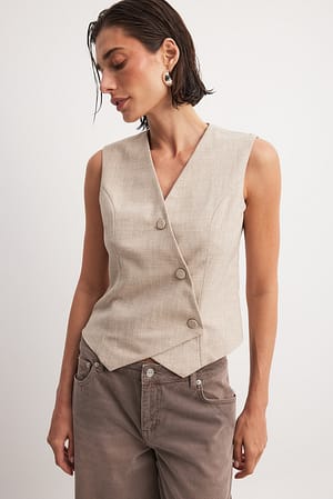 Asymmetrisk vest med knapper