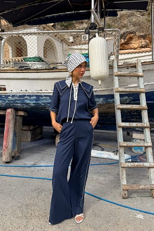 Navy Pantalones rectos de algodón de cintura media