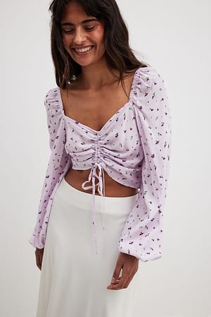 Bluse med løbebånd og lange ærmer