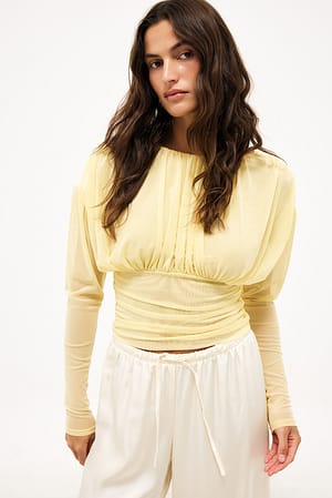 Light Yellow Topp i mesh med markerad midja