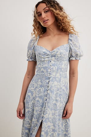 Robe mi-longue boutonnée sur le devant en mousseline