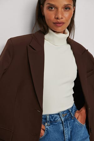 Ärmlös topp med rullkrage