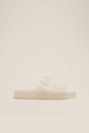 Mules transparentes à boucle