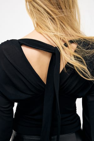 Black Langærmet top i jersey med flæser