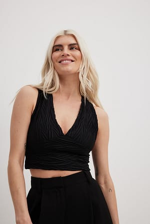 Gestructureerde getailleerde top