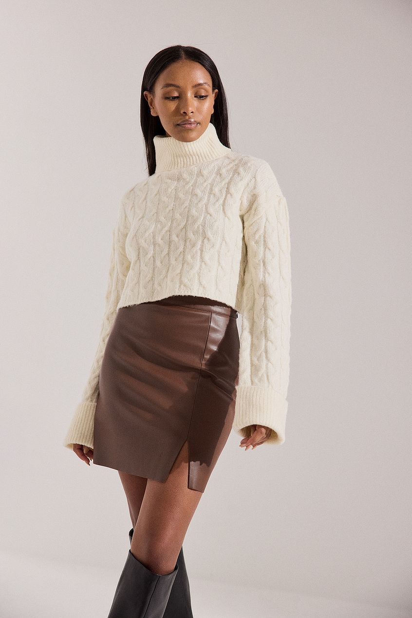 Faux-leather-style skirt with a knit top