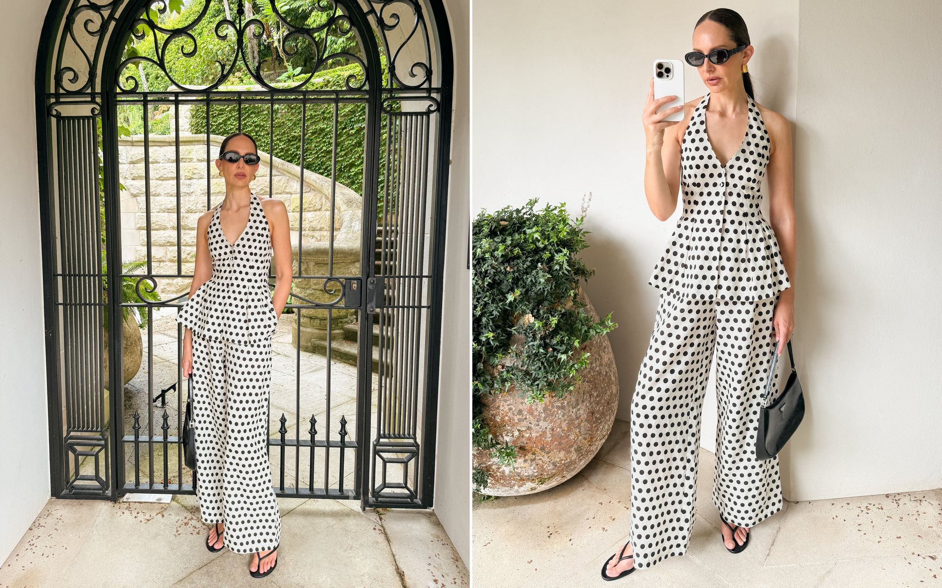 Kvinna i prickigt tvådelat set med halterneck-topp och vida byxor står framför en dekorativ smidesgrind i en grönskande miljö.