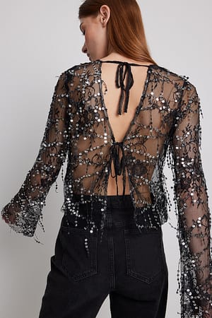 Black Blus med paljetter och knytning fram