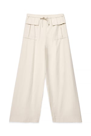 Beige Pantalon décontracté à grandes poches