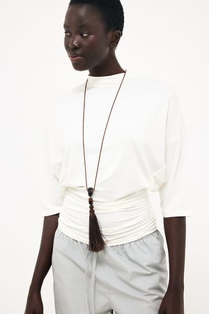White Soft Line topp i jersey med trattformad krage