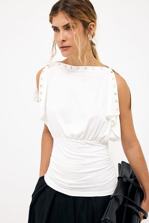 Offwhite Topp med knappar och splittärmar