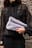 Suede clutch bag with folding detail