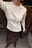 Stricktop mit Fransendetail
