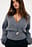 Überlappender Rippenstrickpullover