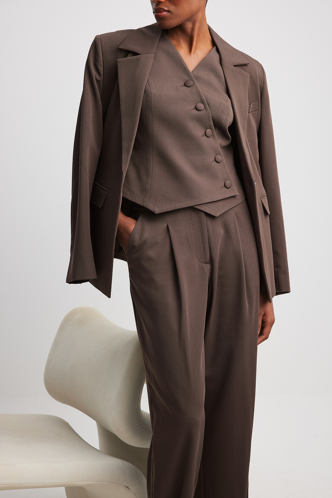 Asymmetric buttoned vest