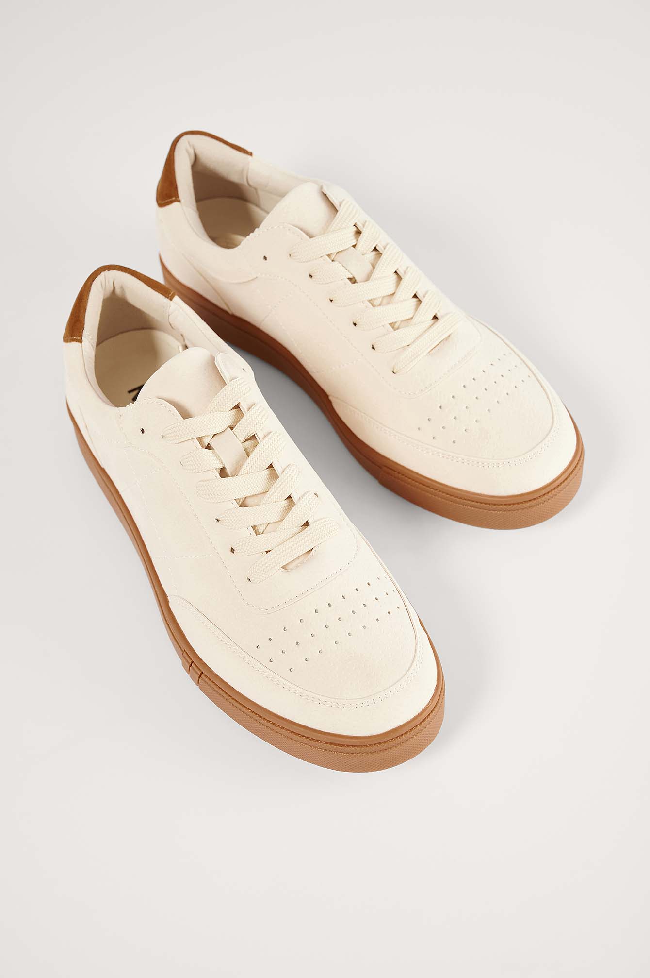 beige white trainers