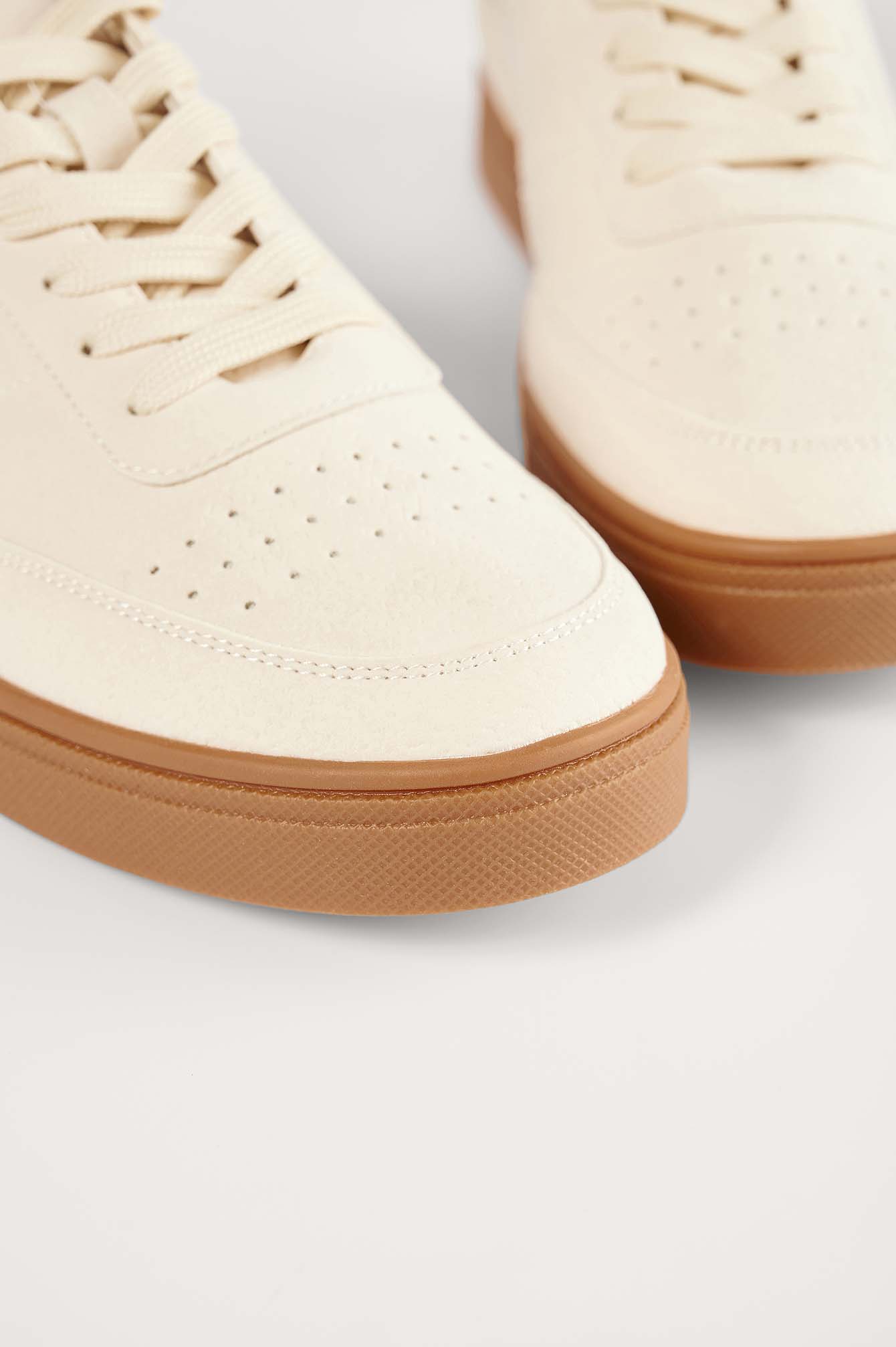 beige white trainers