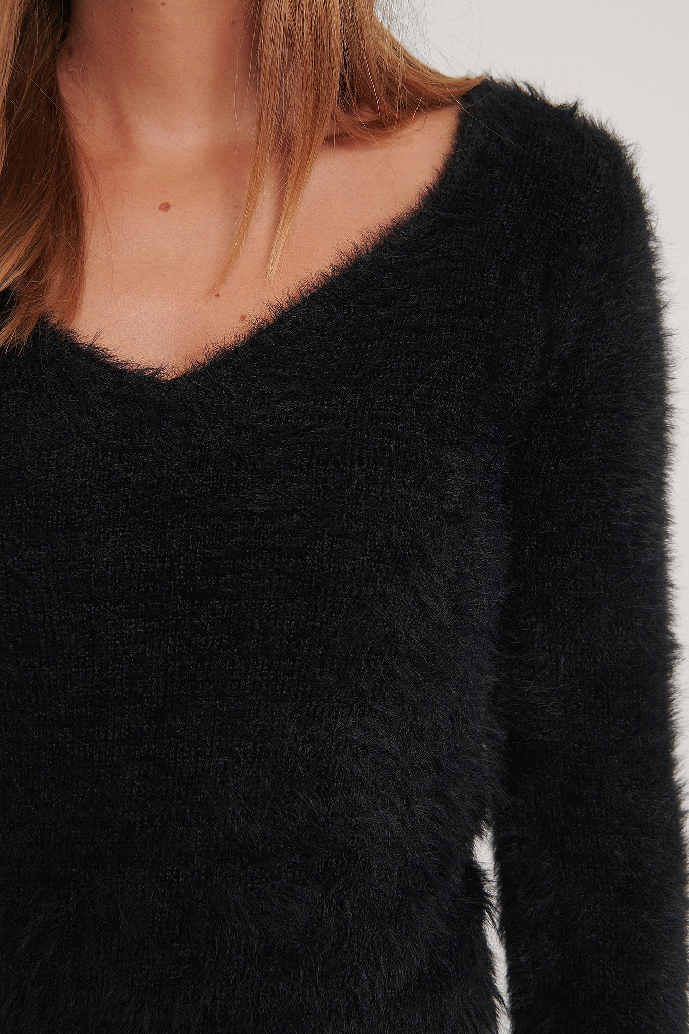 black fluffy sweater