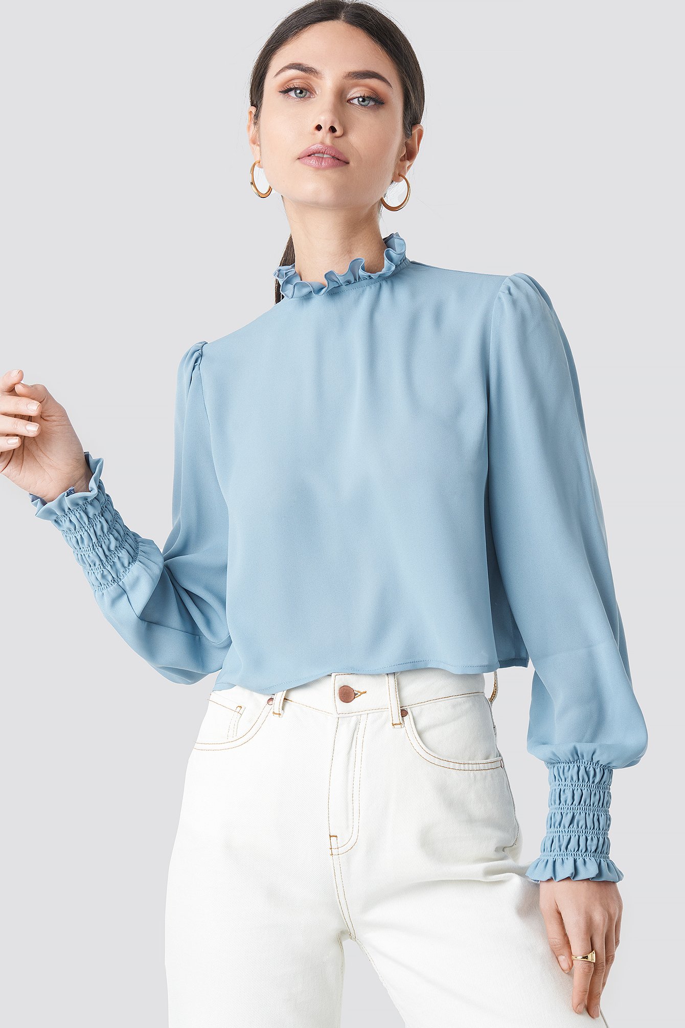 blue high neck blouse