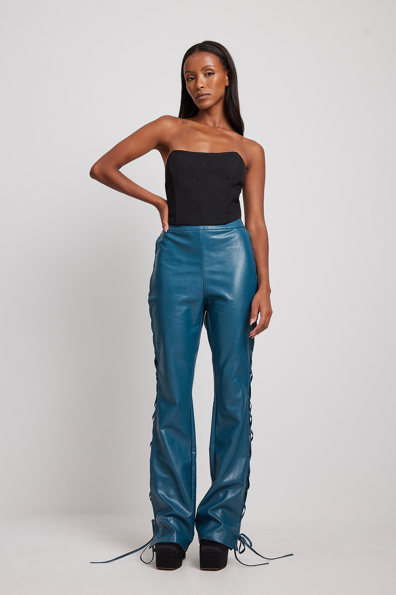 NA-KD high waisted flared faux leather trousers in black