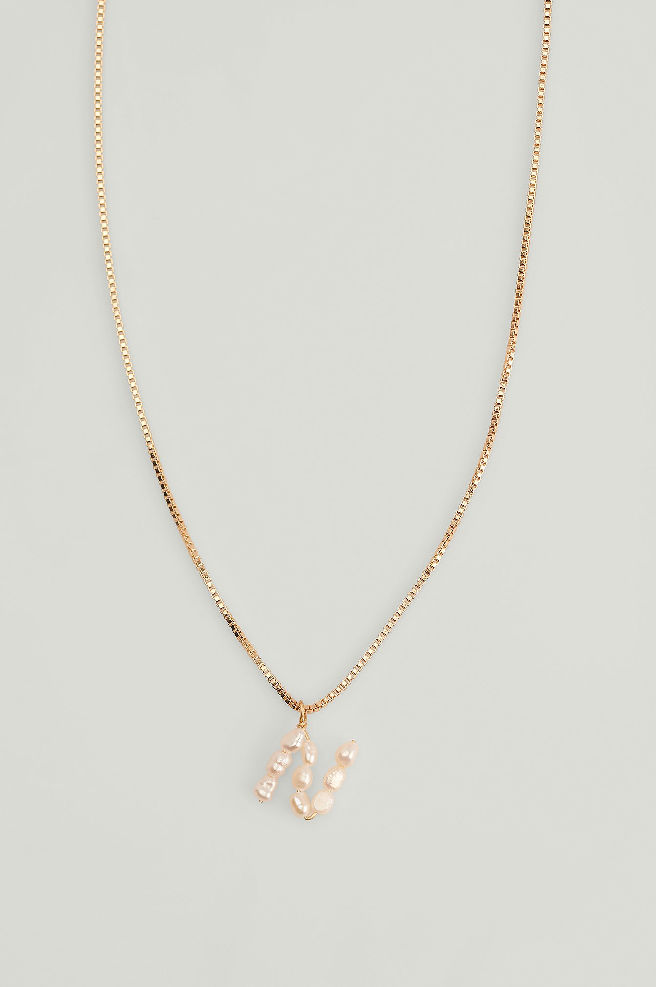 Gold Collar con letra de perla