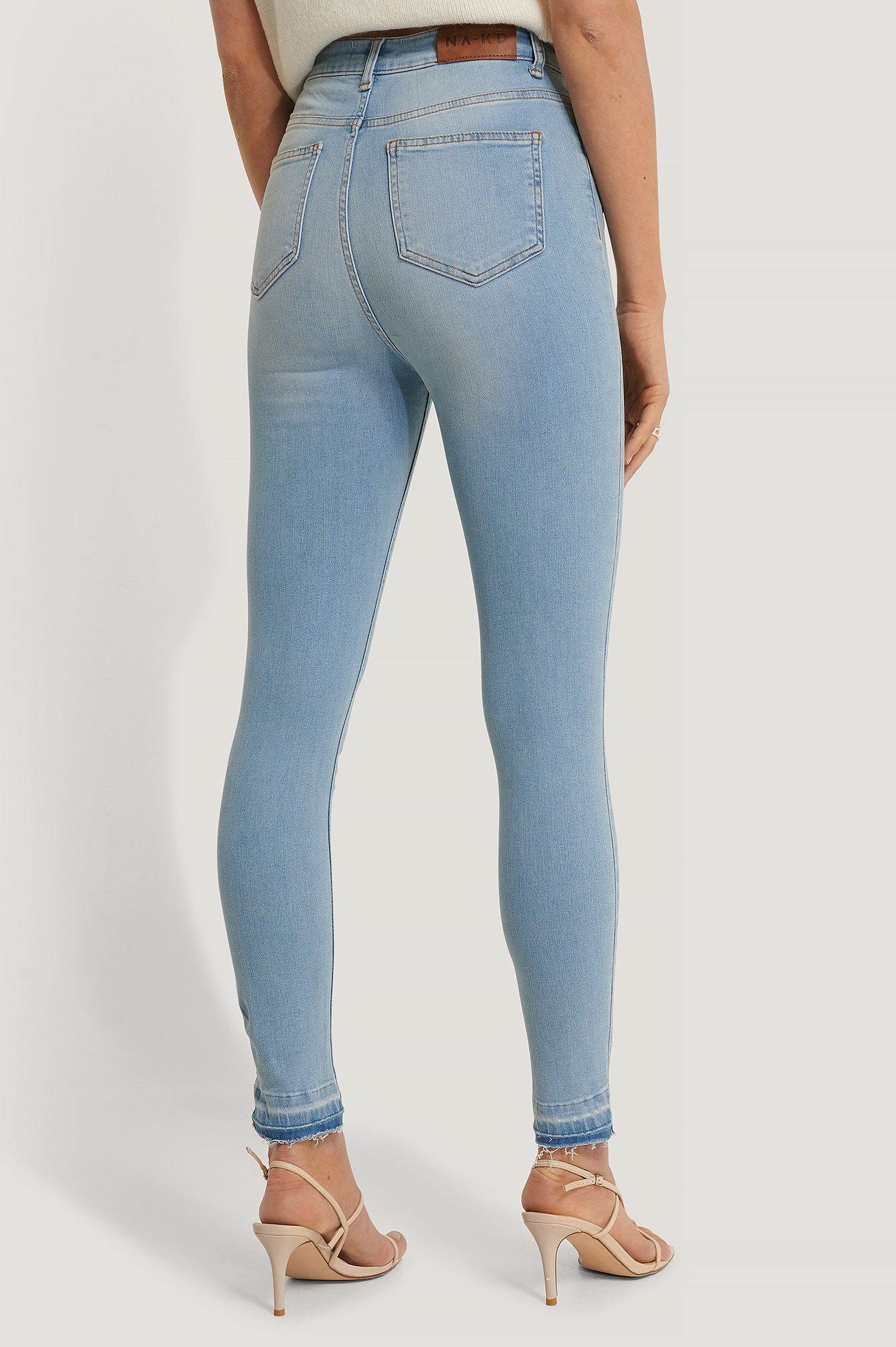 Skinny High Waist Open Hem Jeans Blau