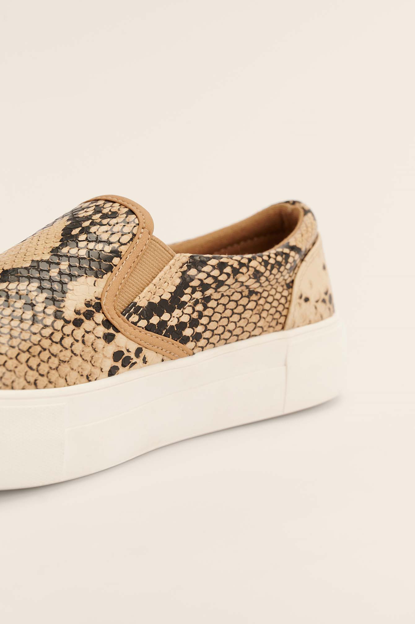 snake print slip on trainers