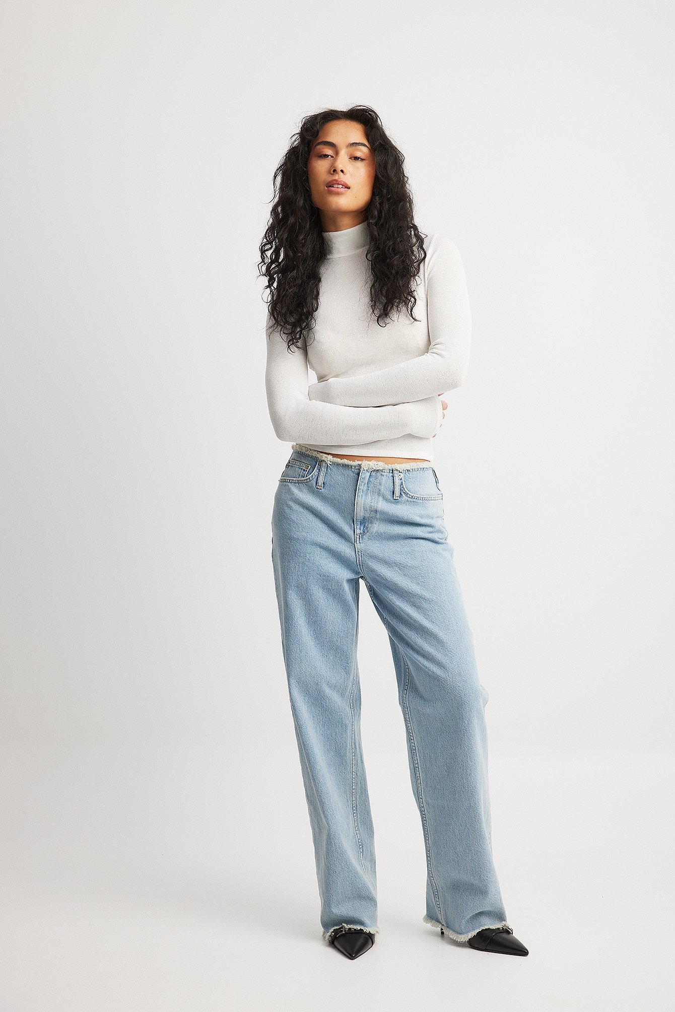 Distressed hem jeans
