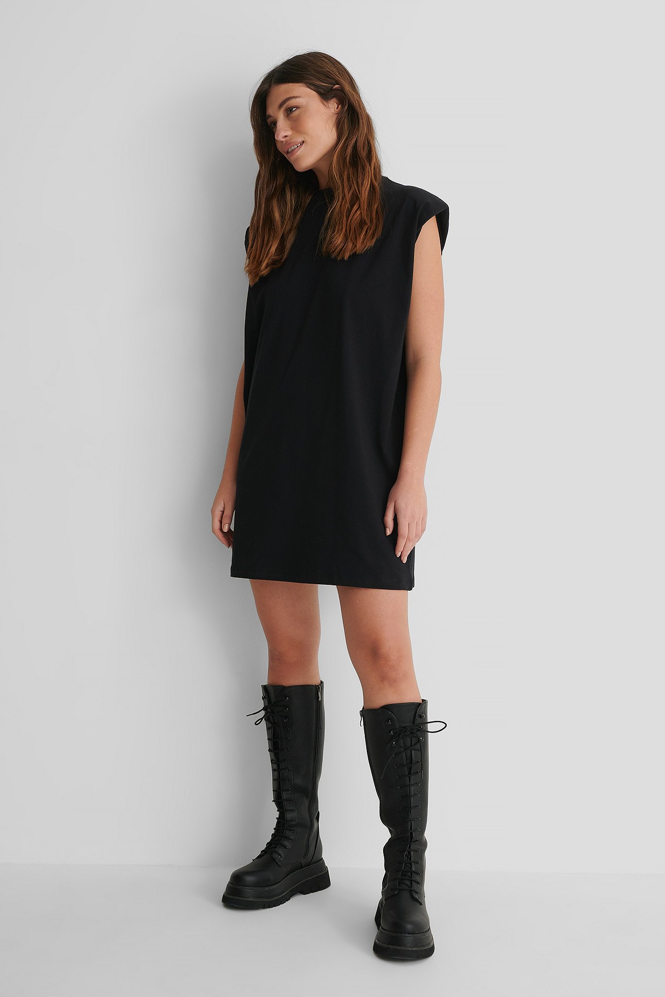 Shoulder Pad Mini Dress with Lace Shaft Boots.