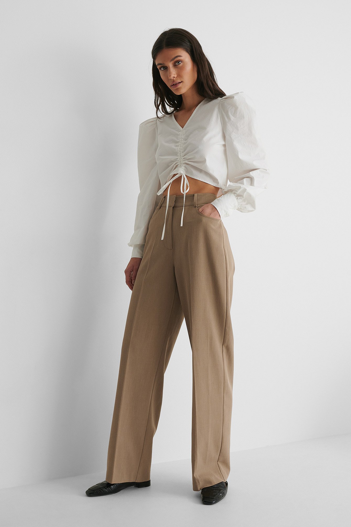 Cotton Drawstring Top with Suit Pants and Loafers.