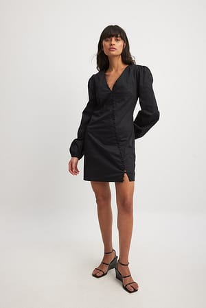 Black Asymmetrische mini-jurk met lange mouwen en knopen