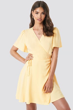 Yellow Camille Botten x NA-KD Wrap Mini Dress
