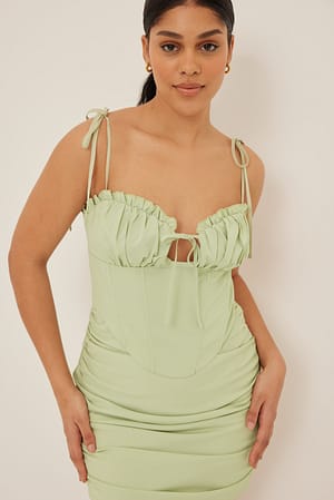 Pistachio Mini abito con dettaglio corsetto