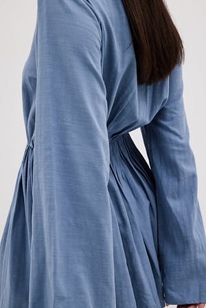 Blue Flowy mini-jurk met diepe V-hals