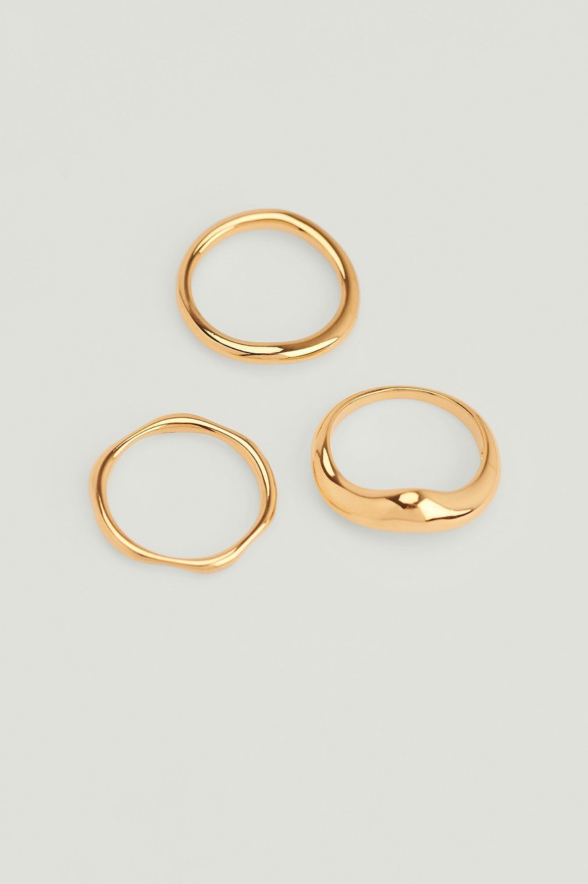 Calidad premium Complementos | Pack de 3 anillos con forma de onda reciclados bañados en oro - HN60073