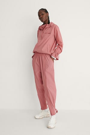 pink and white jogging suit