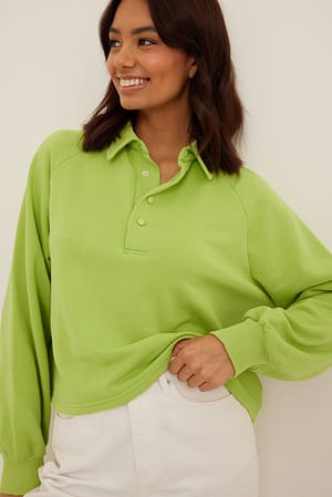 Lime Light Sweater med knapper på krave