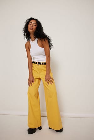 Mustard Jeans de corte reto com costura contrastante