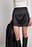 Minifalda de satén ajustada con cintura alta