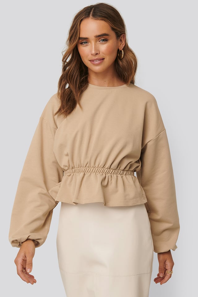 Collegepusero Laskostuksella Beige