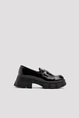 Black Skinande patent loafers