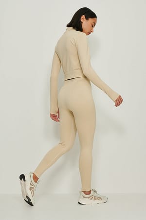 Prijs Missie Snel Gerecycleerde geribde panty met hoge taille Beige | NA-KD