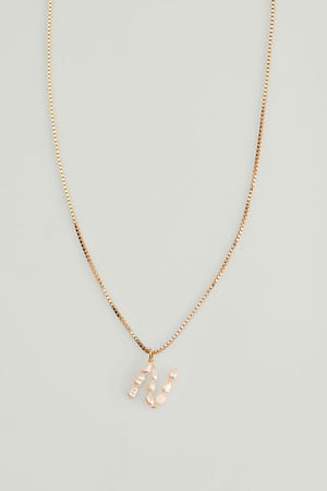 Gold Collar con letra de perla