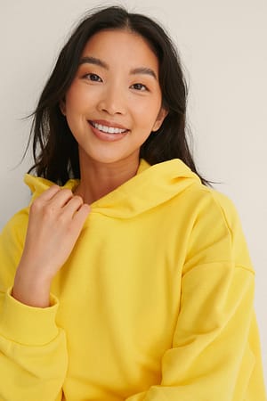 Yellow Ekologisk oversize hoodie med ficka