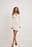 Ribgebreide mini-jurk met knoopdetail