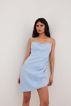 Blue Uitlopende linnen jurk met overslag