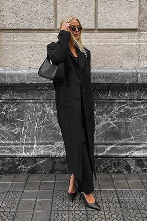 Black Lång kappa i tweed med fickdetalj