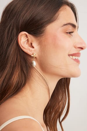 Gold Ohrringe mit Seestern und Perle