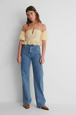 Off Shoulder Puff Short Sleeve Top with Blue Denim and Boots.