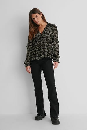 Structured Printed Frill Blouse with Black Slit Jeans and Boots.